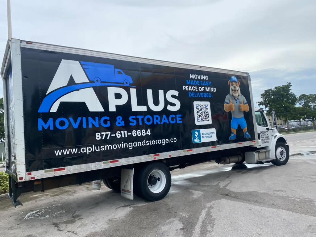 A Plus Moving & Storage box truck, side view